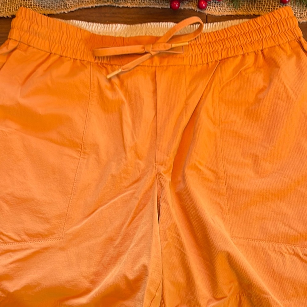 Men’s Lululemon athletic shorts, color, orange, and size large.